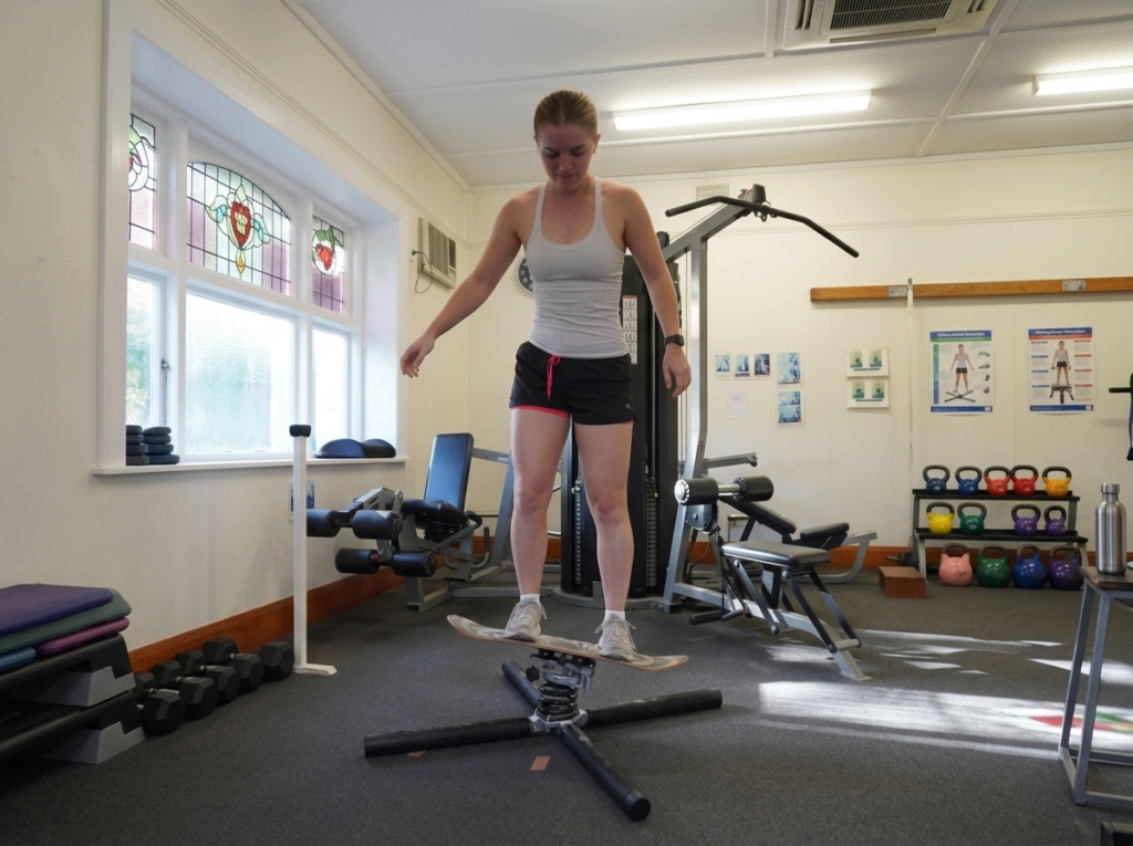 Client-using-balance-pad-in-Redwood-Physio-Gym